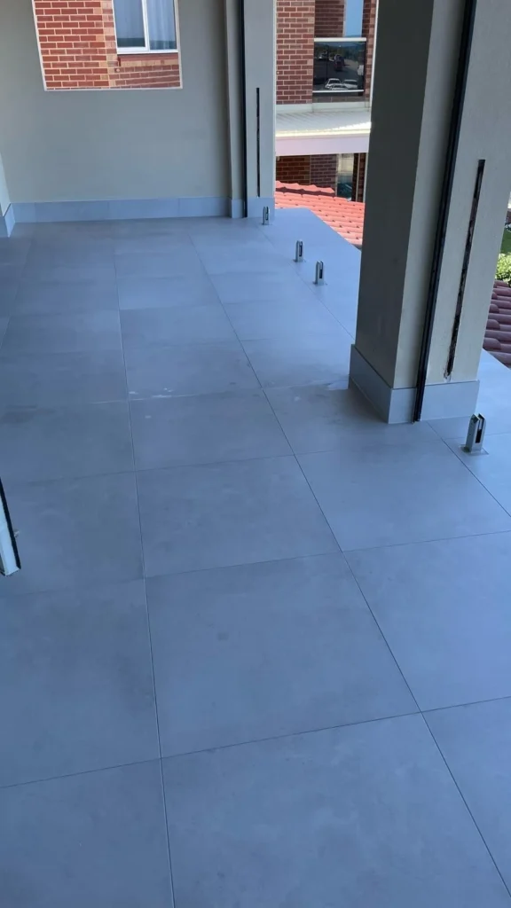 Balcony tiling installation in progress in Adelaide by First Quality Tiling